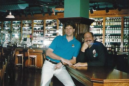 #FBF to Orlando in 1992! Jimmy, founder of Howl at the Moon (pictured right) in all of his glory 🙌 Jimmy has always been a music lover and continues to be Howl's #1 fan! If you’re lucky, you might catch a glimpse of him up on stage, howling the night away! 🧡 . #howlatthemoon #orlando #florida #90s #mustache #livemusic #flashbackfriday #friday #friyay #partytime
