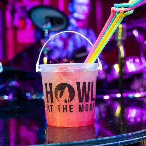 Our Pink Paradise bucket is always ready for a close-up 🤩#starquality . . #howlatthemoon #howltv #pinkparadise #livemusic #welcometotheshow #donqcoconut #ondisplay #bucketdrinks #drinks