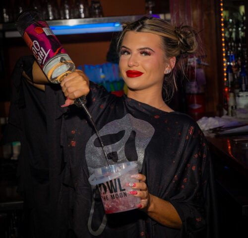Halloween bartender pouring a spooky drink