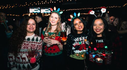 Holiday party with ugly sweaters
