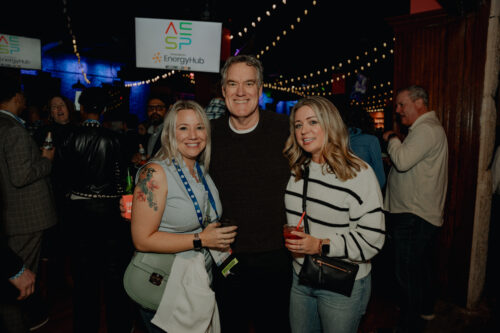 San antonio holiday party two women and a man posing for the camera